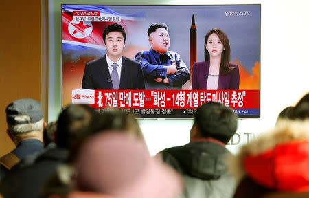 People watch a TV broadcasting a news report on North Korea firing what appeared to be an intercontinental ballistic missile (ICBM) that landed close to Japan, in Seoul, South Korea, November 29, 2017. REUTERS/Kim Hong-Ji