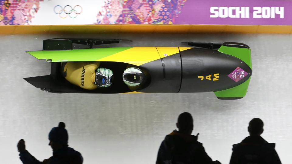 Jamaica's Winston Watts and Marvin Dixon speed down the track during the two-man bobsleigh event at the 2014 Sochi Winter Olympics, at the Sanki Sliding Center in Rosa Khutor February 16, 2014. REUTERS/Fabrizio Bensch (RUSSIA - Tags: SPORT BOBSLEIGH OLYMPICS)