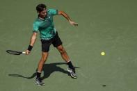 Mar 30, 2017; Miami, FL, USA; Roger Federer of Switzerland hits a forehand against Tomas Berdych of the Czech Republic (not pictured) in a men's singles quarter-final during the 2017 Miami Open at Crandon Park Tennis Center. Federer won 6-2, 3-6, 7-6(6). Mandatory Credit: Geoff Burke-USA TODAY Sports