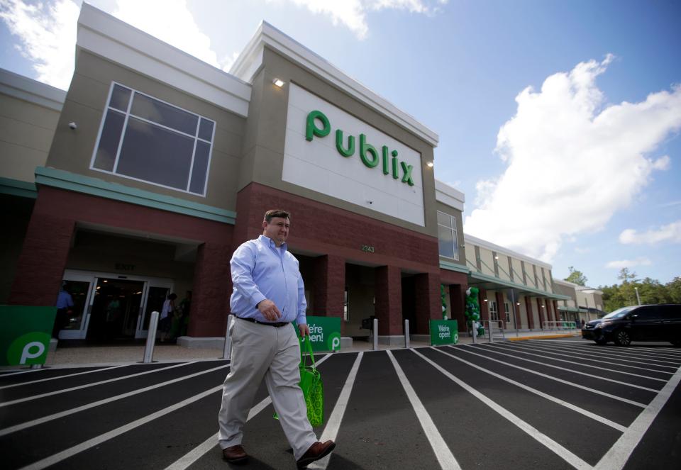 A shopper exits the new Publix in Crawfordville, Fla. on its opening day on Thursday, Aug. 4, 2022. 