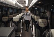 <h2>Tending to passengers in Santiago de Compostela</h2>Tania Leon, a 29 year-old stewardess, poses for a picture inside a bus in Santiago de Compostela, Spain May 9, 2012. Leon studied psychology at the University of Santiago de Compostela and received a degree in 2006. She was hoping to find a job as a psychologist but has been working as a stewardess for the last two years.