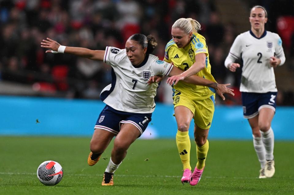 LONDON, ENGLAND – APRIL 05: Lauren James of England holds off <a class="link " href="https://sports.yahoo.com/soccer/players/809402/" data-i13n="sec:content-canvas;subsec:anchor_text;elm:context_link" data-ylk="slk:Jonna Andersson;sec:content-canvas;subsec:anchor_text;elm:context_link;itc:0">Jonna Andersson</a> of Sweden during the UEFA Women’s European Qualifier match between England and Sweden on April 05, 2024 in London, England. (Photo by Mike Hewitt/Getty Images) (Photo by Mike Hewitt/Getty Images)