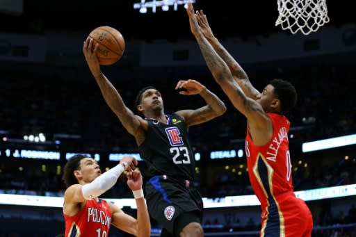 Lou Williams of the LA Clippers shoots against Nickeil Alexander-Walker in a 133-130 NBA victory over the New Orleans Pelicans