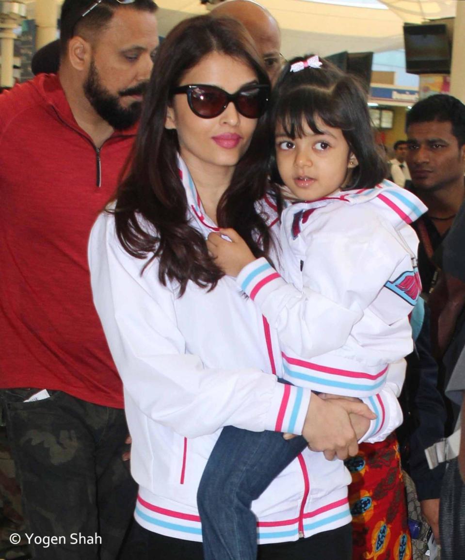 Aaradhya and her parents wore similar jackets, bearing the name of Jaipur Pink Panthers, as they flew back to Mumbai after the match.