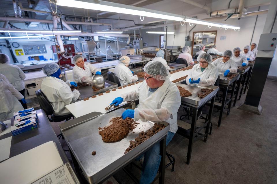 Workers making Twin Bing by hand.