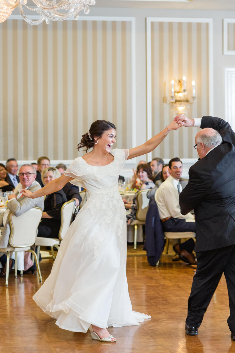 The bride twirls in her mom's wedding dress during the father-daughter dance. (Photo: <a href="http://ashleyelizabethphotography.com/" target="_blank">Ashley Elizabeth Photography</a>)