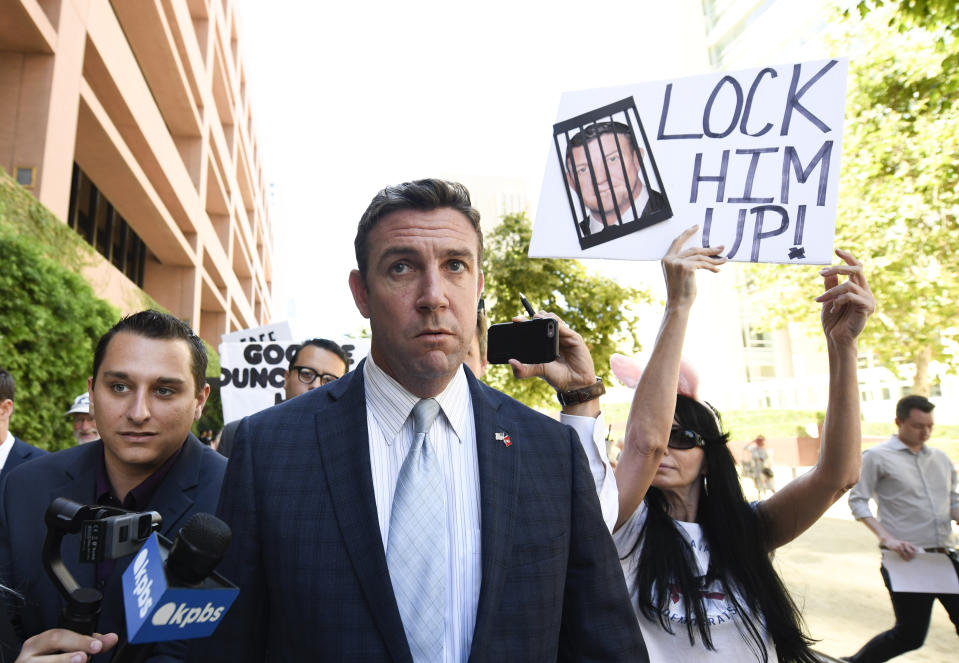 FILE - In this July 1, 2019, file photo, U.S. Rep. Duncan Hunter, R-Calif., leaves federal court after a hearing in San Diego. Hunter, who is facing corruption charges, wants his Sept. 10 trial postponed while his attorneys appeal a judge's refusal a month earlier to dismiss the case. (AP Photo/Denis Poroy, File)