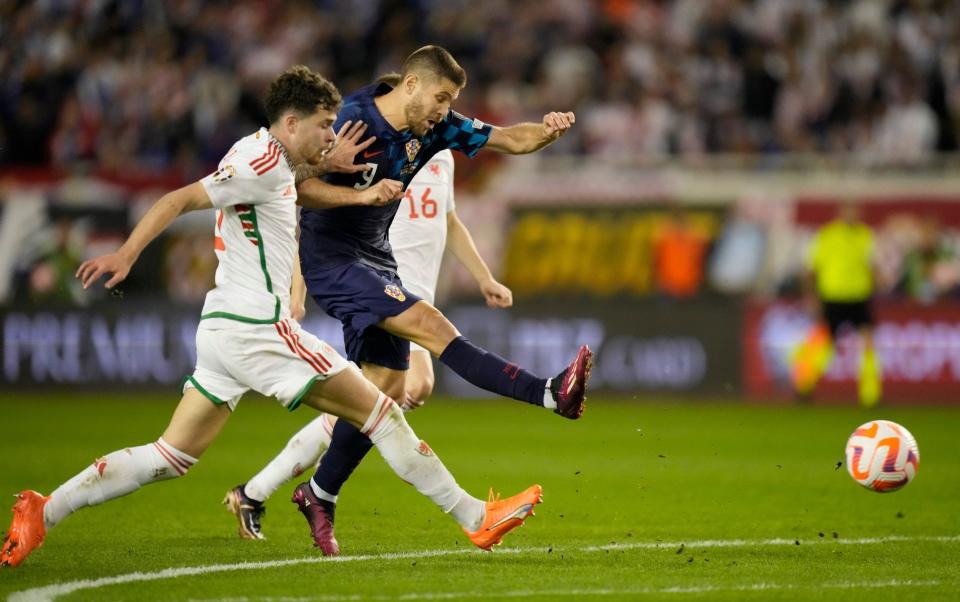 Andrej Kramaric, centre, scores his side's opening goal - AP Photo/Darko Bandic