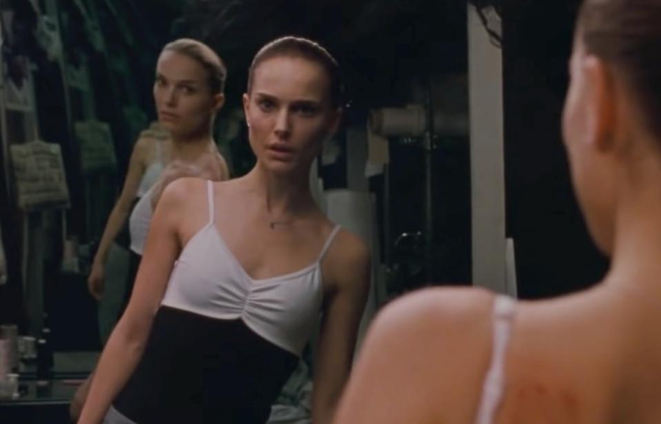 Natalie Portman in "Black Swan" is looking at her reflection in the mirror