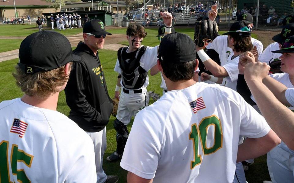 Tumwater head coach Lyle Overbay talks with his team before the T-Birds host the visiting Aberdeen Bobcats in a 2A Evergreen league contest on Thursday, April 7.