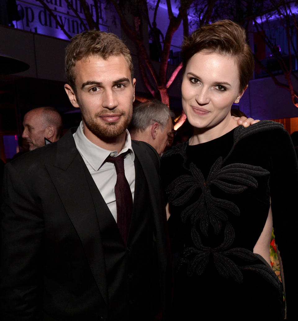 LOS ANGELES, CA - MARCH 18:  Actor Theo James (L) and writer Veronica Roth pose at the after party for the premiere of Summit Entertainment's 'Divergent' at The Armand Hammer Museum on March 18, 2014 in Los Angeles, California.  (Photo by Kevin Winter/Getty Images)