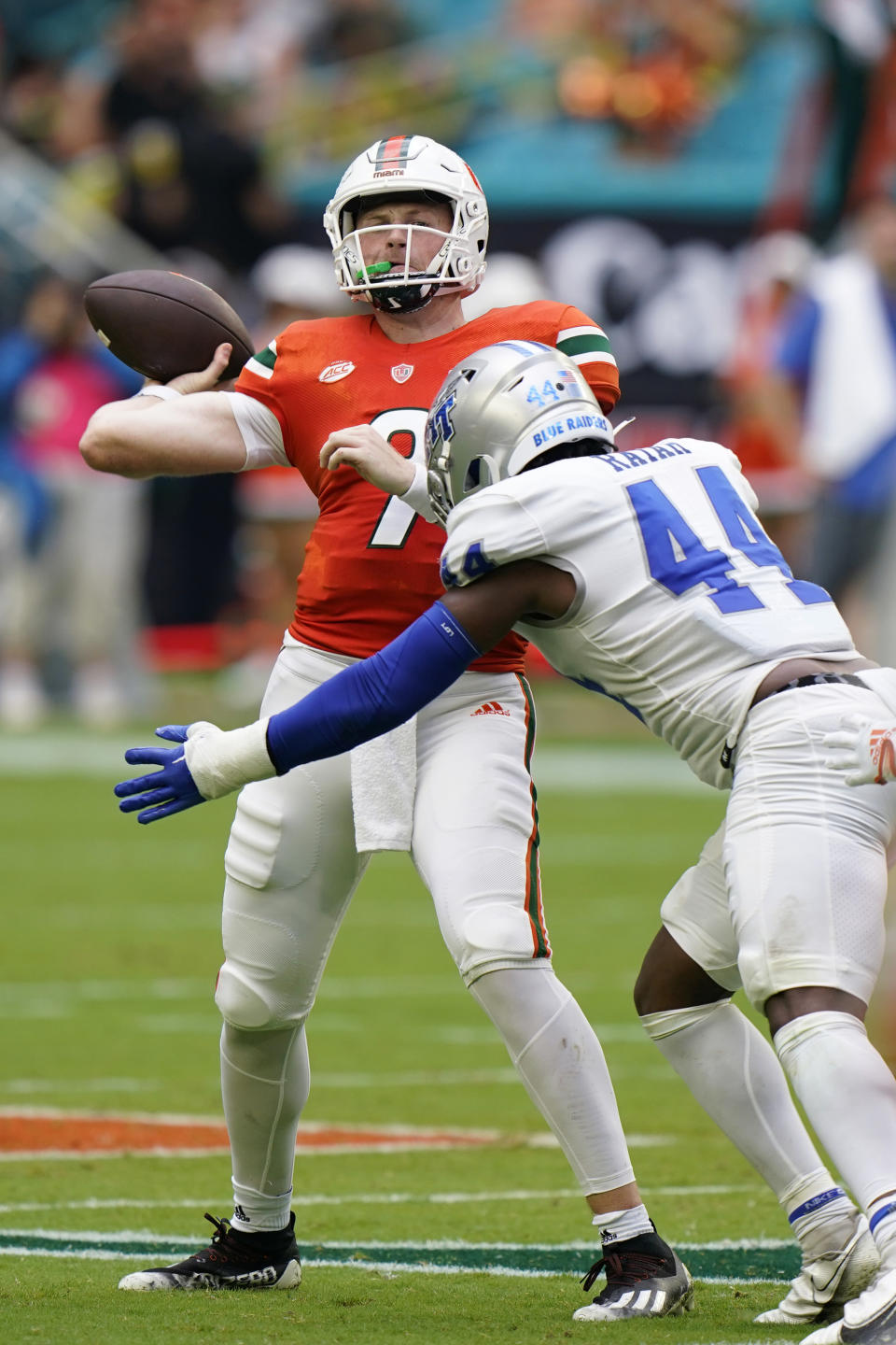 Middle Tennessee linebacker Jalen Rayam (44) rushes Miami quarterback Tyler Van Dyke (9) as he passes during the first half of an NCAA college football game, Saturday, Sept. 24, 2022, in Miami Gardens, Fla. (AP Photo/Wilfredo Lee)