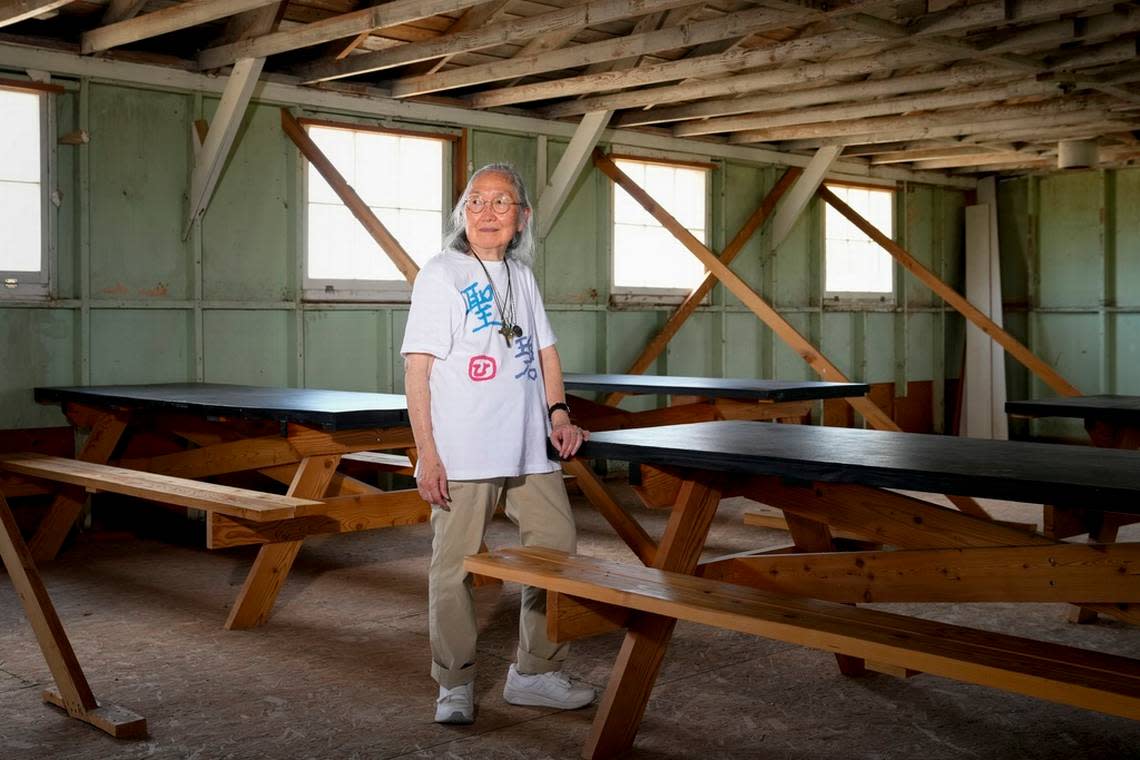 Sally Nakai Kobayashi, who was born at Minidoka in April of 1945, poses for a portrait in an original mess hall building similar to one her mother worked. Kobayashi was visiting the site with her younger sister and son for the first time since 1945, when the concentration camp closed following the end of World War II.
