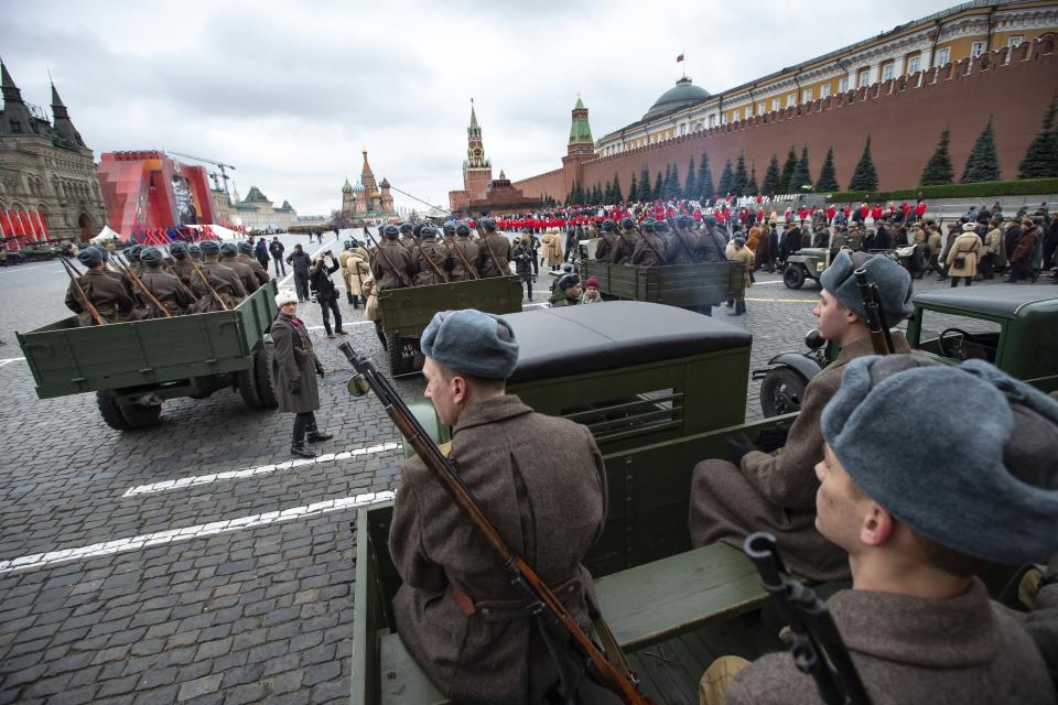 Russian soldiers dressed in Red Army World War II winter uniforms wait to take a part in a reconstruction of a World War II-era parade in Moscow's Red Square, Russia, Thursday, Nov. 7, 2019. The parade marks the 78th anniversary of a World War II historic parade in Red Square and honored the participants in the Nov. 7, 1941 parade who headed directly to the front lines to defend Moscow from the Nazi forces. (AP Photo/Alexander Zemlianichenko)