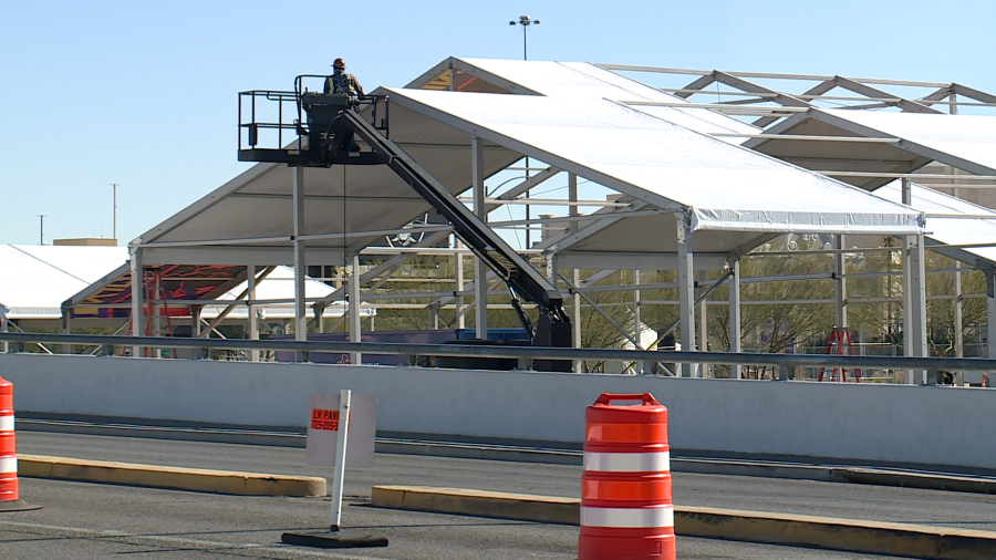 <em>NFL contractors installing hospitality tents within the Allegiant Stadium parking lot Tuesday. (KLAS)</em>