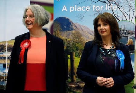 Labour Party candidate Gillian Troughton (L) looks away as Conservative Party candidate Trudy Harrison (R) smiles after winning the Copeland by-election in Whitehaven, Britain, February 24, 2017. REUTERS/Phil Noble