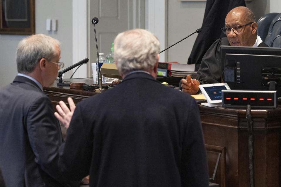 Creighton Waters for the state and Dick Harpootlian for the defense speak with Judge Clifton Newman as jury selection begins the in Alex Murdaugh murder trial at the Colleton County Courthouse in Walterboro, S.C. on Monday, Jan. 23, 2023.( Joshua Boucher/The State via AP, Pool)