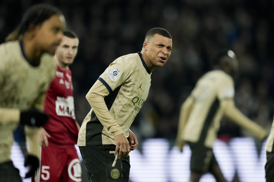 PSG's Kylian Mbappe gestures during the French League One soccer match between Paris Saint-Germain and Brest at the Parc des Princes stadium in Paris, France, Sunday, Jan. 28, 2024. (AP Photo/Thibault Camus)