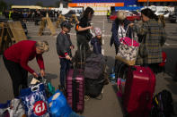 People arrive at a reception center for displaced people in Zaporizhzhia, Ukraine, Monday, May 2, 2022. Thousands of Ukrainian continue to leave Russian occupied areas. (AP Photo/Francisco Seco)