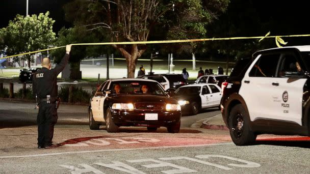 PHOTO: Police officers investigate after a shooting at Peck Park, Los Angeles, July 24, 2022. (Chine Nouvelle/SIPA/Shutterstock)