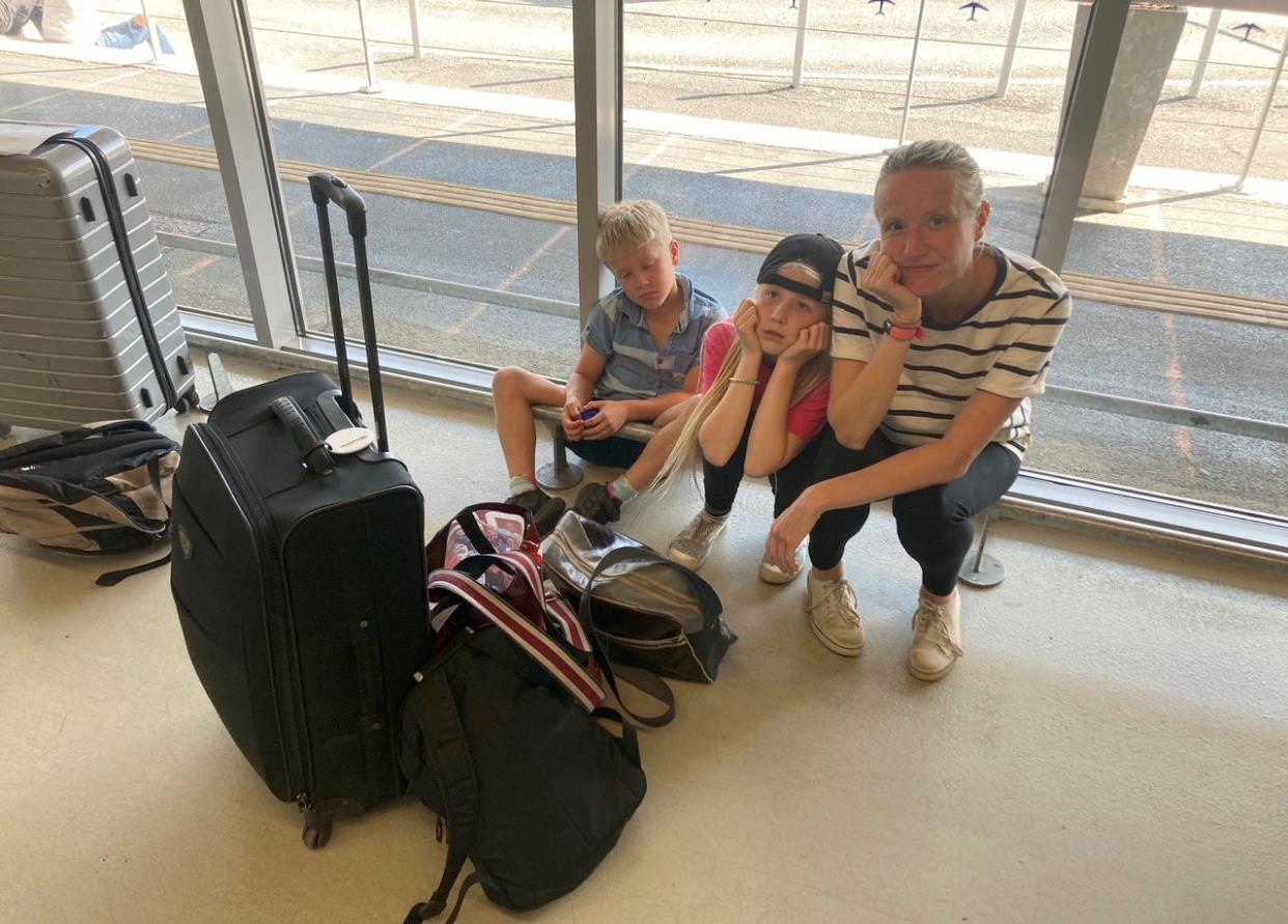Rory Dollard's wife Joanne and their children Emily, 10, and Arthur, eight at Bergerac Dordogne Perigord Airport (PA)