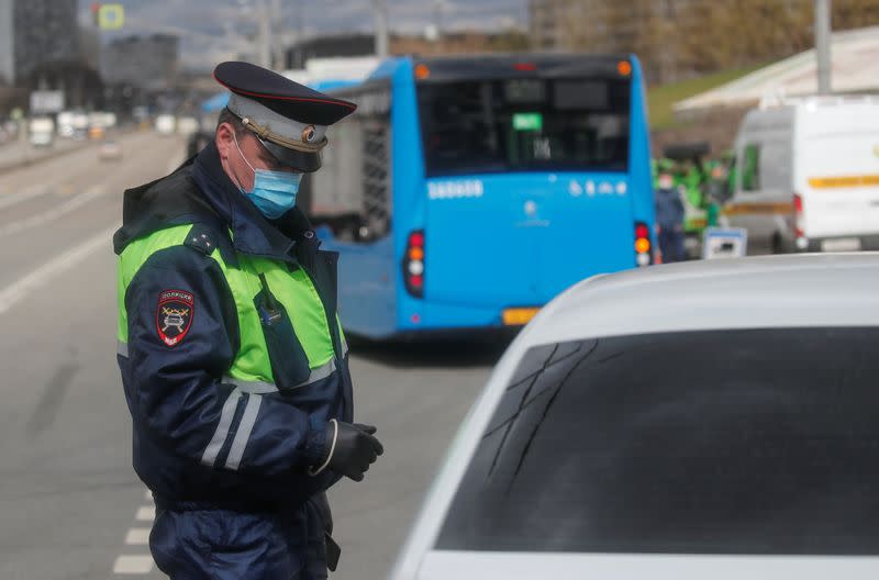 A traffic police officer works at a check point on the outskirts of Moscow