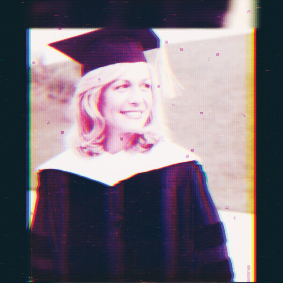 Women wearing a graduation gown and cap.