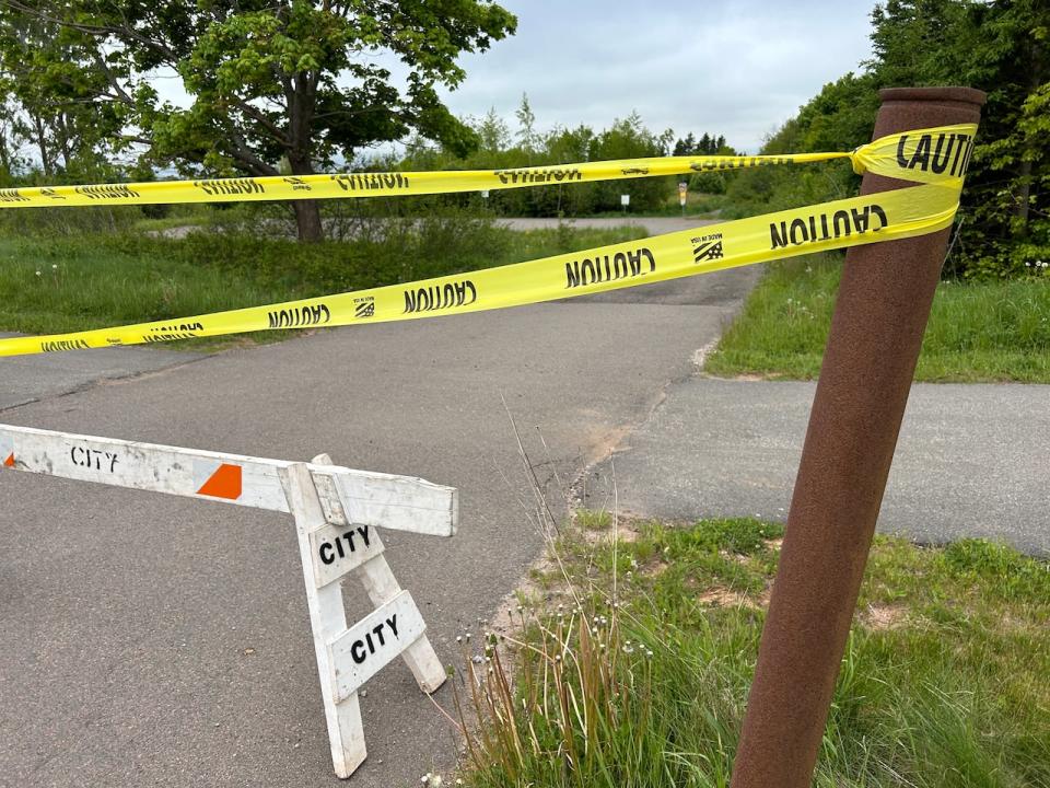 One of the three parking lots at Upton Farmlands is blocked off with caution tape until the group that manages the park can get the word out on potential dangers.