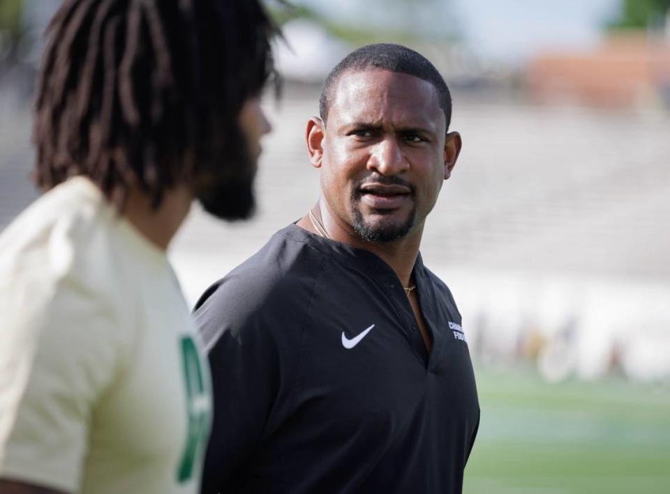 Dre’ Bly (center), an 11 year veteran of the NFL, begins his first year on the Charlotte 49ers coaching staff.