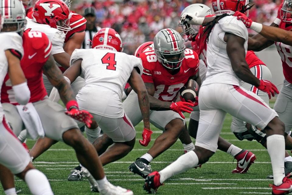 Sep 09, 2023; Columbus, OH, USA; Ohio State Buckeyes running back Chip Trayanum (19) breaks through the Youngstown State defense during their NCAA football game at Ohio Stadium.