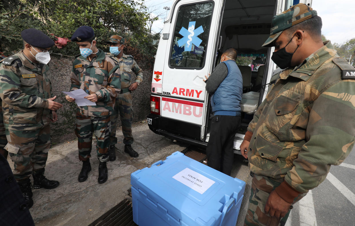 Indian army personnel assist in distributing the Covid-19 vaccines (EPA-EFE)