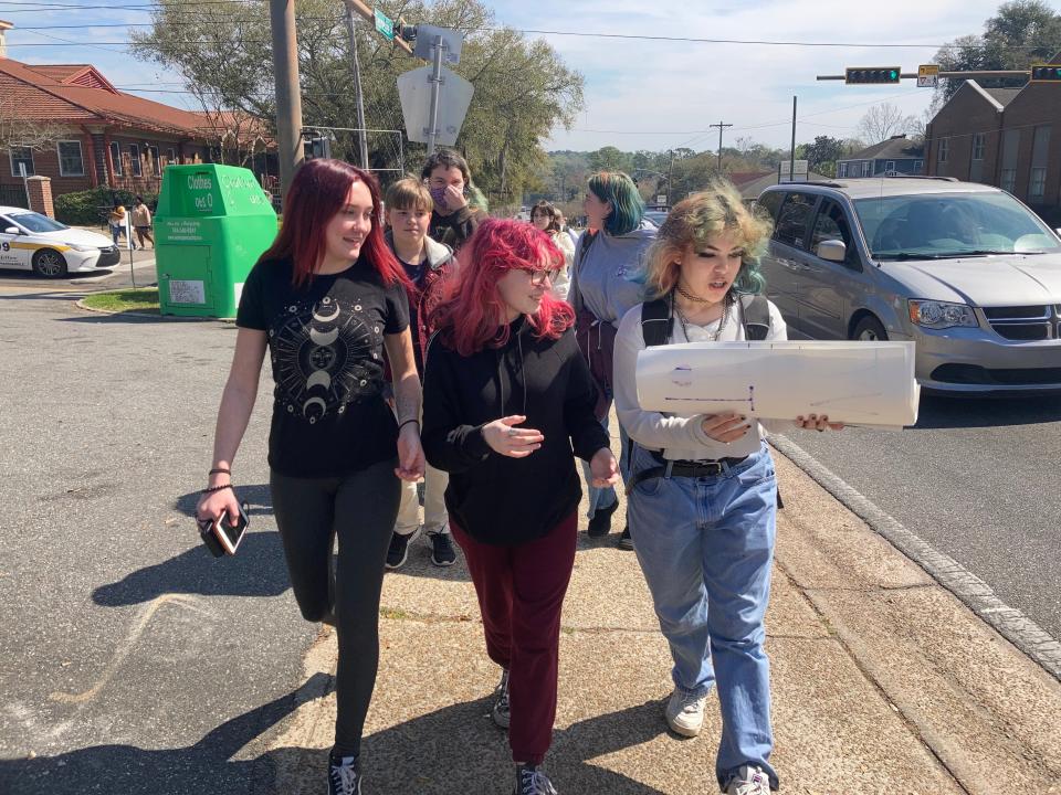 From left, Ella Claire, Kit Nelson and Jojo walk to the Florida Capitol at noon to protest House Bill 1557, also known as the "Don't Say Gay" bill by critics.