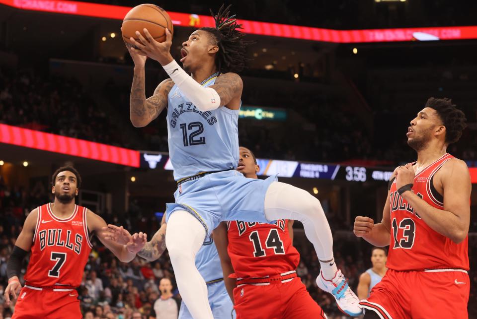 Memphis Grizzlies guard Ja Morant finishes off a 360-degree layup against the Chicago Bulls at FedExForum on Monday, Jan. 17, 2022.