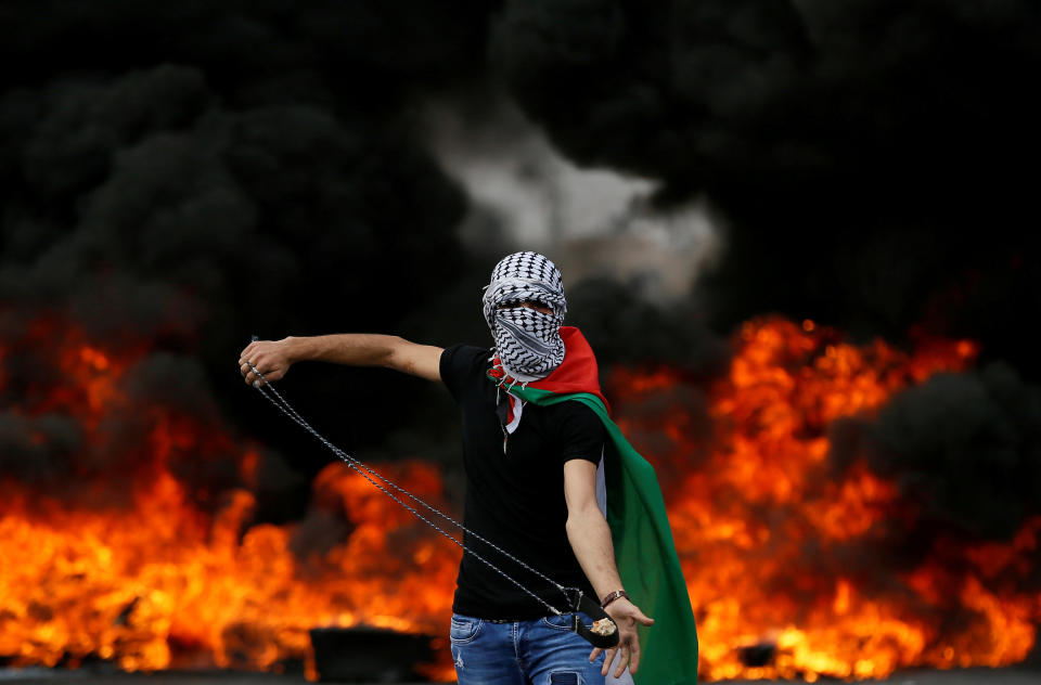 A Palestinian demonstrator holds a sling during a protest marking the 70th anniversary of Nakba, near the Jewish settlement of Beit El, near Ramallah, in the occupied West Bank May 15, 2018.&nbsp;