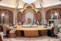 In this photo made available by Saudi Press Agency, SPA, Saudi Crown Prince and Prime Minister Mohammed bin Salman, center, talks with Gulf Arab leaders during the Gulf Cooperation Council (GCC) Summit, in Riyadh, Saudi Arabia, Friday, Dec. 9, 2022. Gulf Arab leaders and others in the Mideast met Friday in Saudi Arabia as part of a state visit by Chinese leader Xi Jinping, seeking to firm up their relations with Beijing as decades of U.S. attention on the region wanes. (Saudi Press Agency via AP)