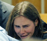 Knox breaks down after her murder sentence was overtuned in Perugia, Italy on Monday.
