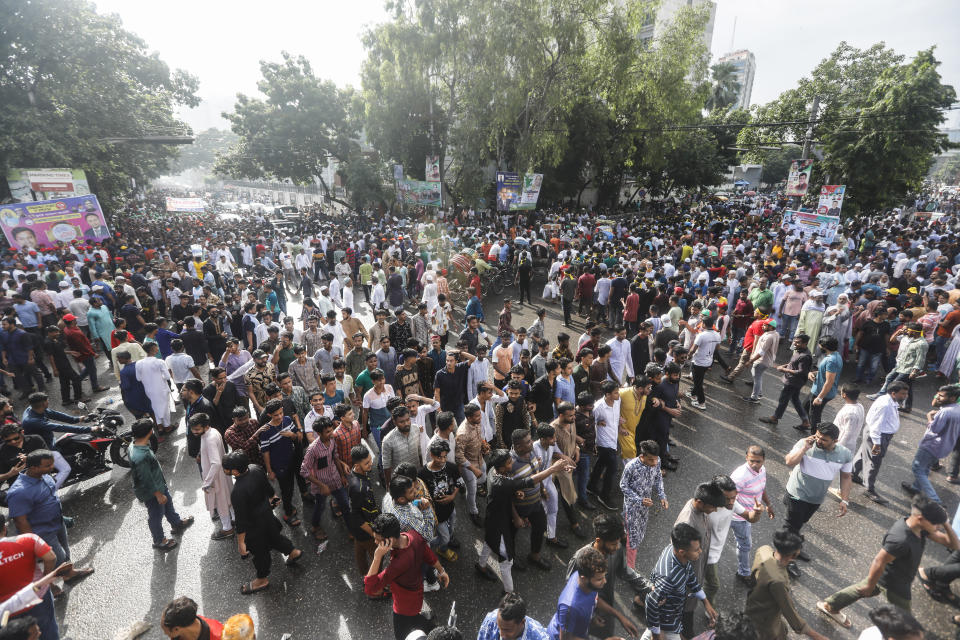 Bangladesh's ruling Awami League supporters shout slogans as they gather for a peace rally in Dhaka, Bangladesh, Friday, July 28, 2023. Thousands of supporters of Bangladesh's governing and opposition parties have held separate rallies over who should oversee the next general election, expected to be held early next year. Despite huge crowds, both rallies were peaceful, with a large security presence. (AP Photo/Mahmud Hossain Opu)