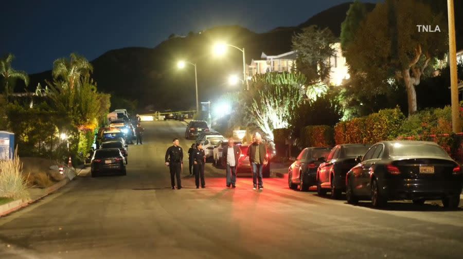 Law enforcement and loved ones arrive at Matthew Perry's Pacific Palisades home following news of the actor's death on Oct. 28, 2023. (TNLA)