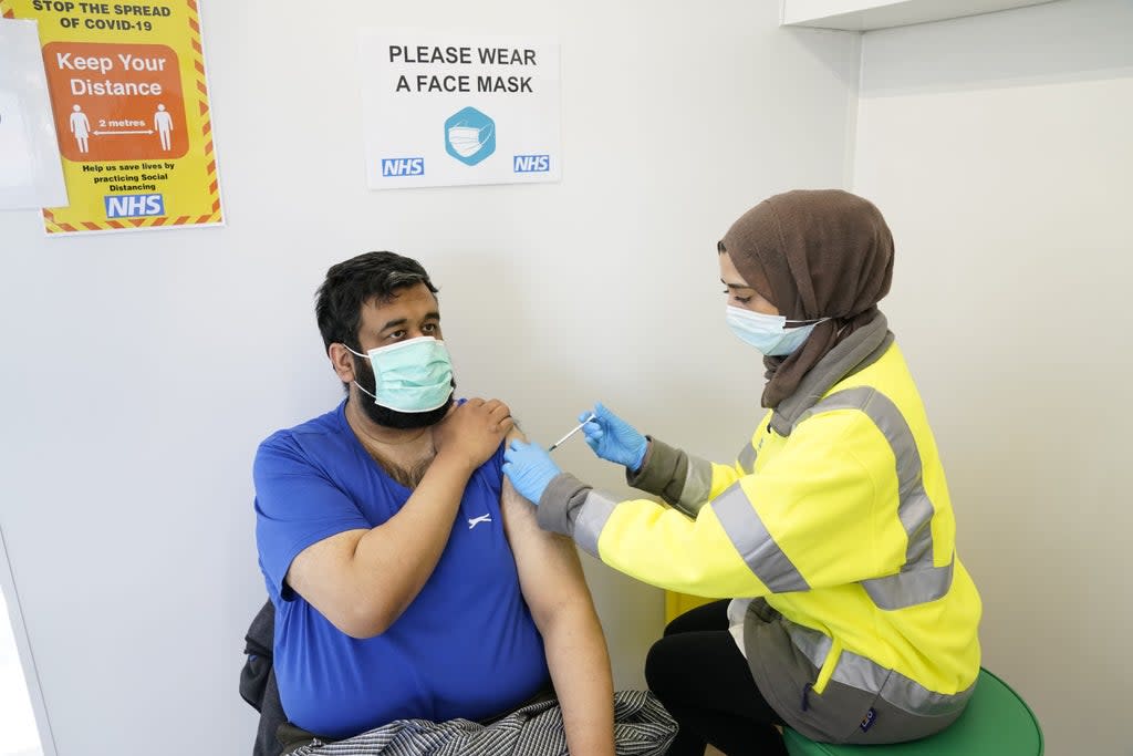 Riswan Mahmood receives his Covid-19 vaccination at the Penny Street vaccination centre in Blackburn. Experts in the UK are quickly trying to work out how quickly a new South African variant may spread and whether it is more deadly. (PA Archive)