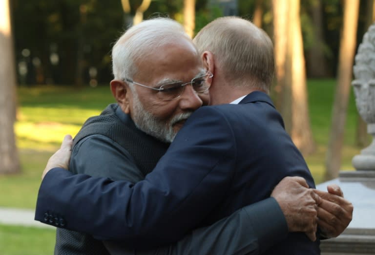 Indian Prime Minister Narendra Modi and Russian President Vladimir Putin embrace at the Novo-Ogaryovo state residence outside Moscow on Monday (Gavriil GRIGOROV)