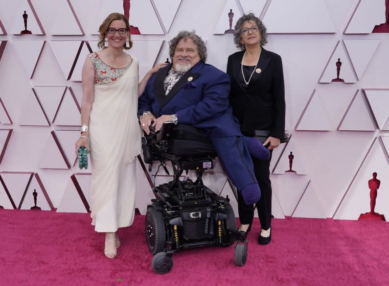 Nicole Newnham, left, James LeBrecht and Sara Bolder arrive at the 2021 Oscars at Union Station in Los Angeles