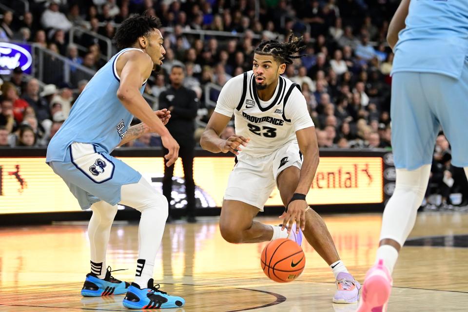 Providence forward Bryce Hopkins drives to the basket against Rhode Island in Saturday's game.