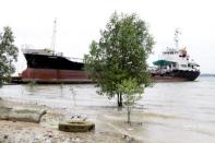 The beached Prosper oil tanker on Johor river August 24, 2016. REUTERS/Henning Gloystein