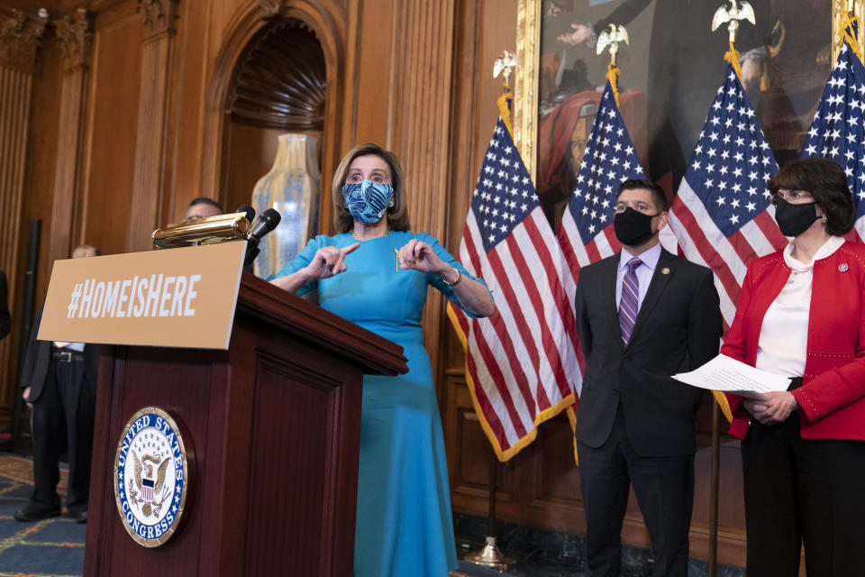 Speaker of the House Nancy Pelosi, joined by Representative Raul Ruiz, chairman of the Congressional Hispanic Caucus, and Representative Lucille Roybal-Allard, discusses an upcoming vote on the American Dream and Promise Act of 2021 at the Capitol on Thursday, March 18, 2021. / Credit: J. Scott Applewhite / AP