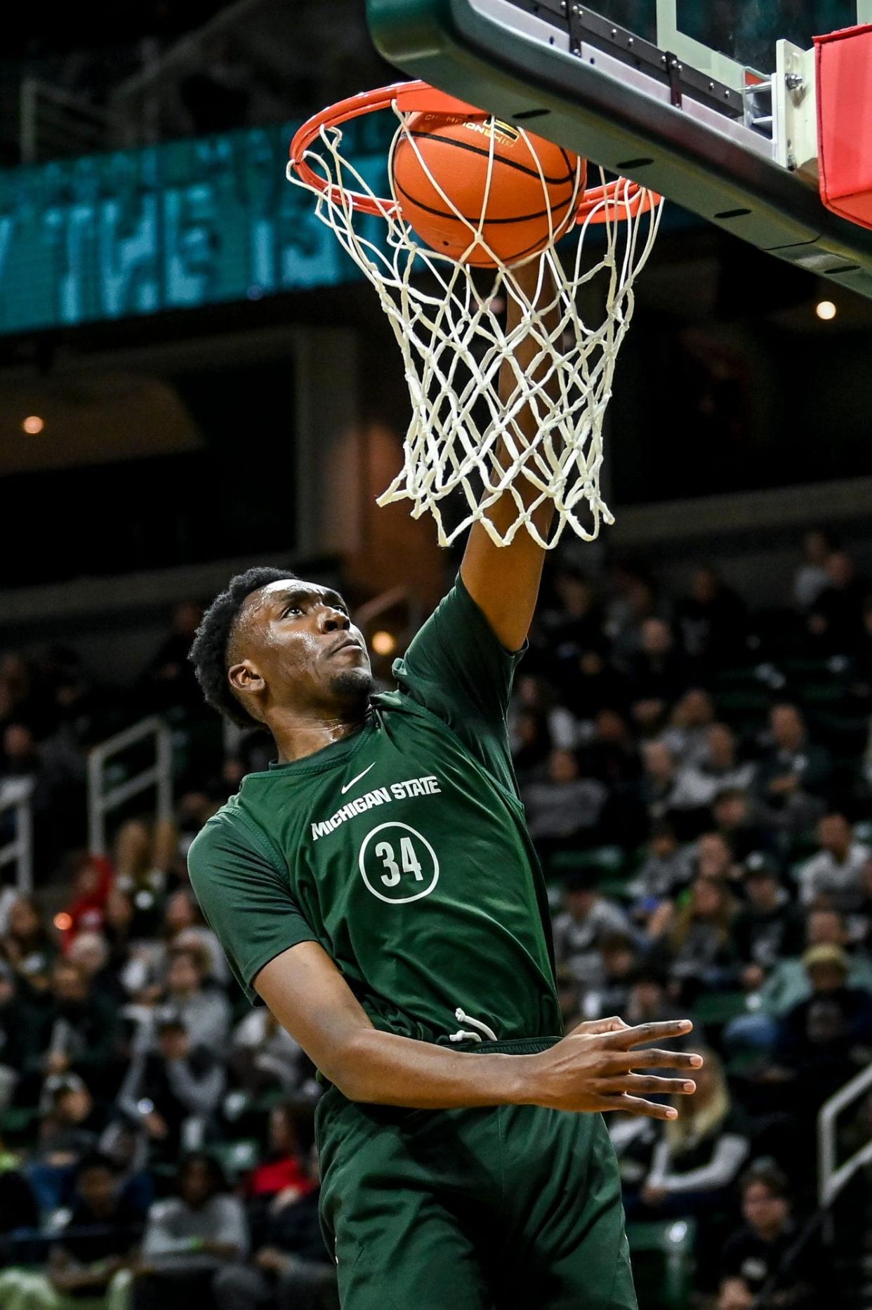 Michigan State's Xavier Booker dunks during the Michigan State Madness event on Friday, Oct. 13, 2023, at the Breslin Center in East Lansing.