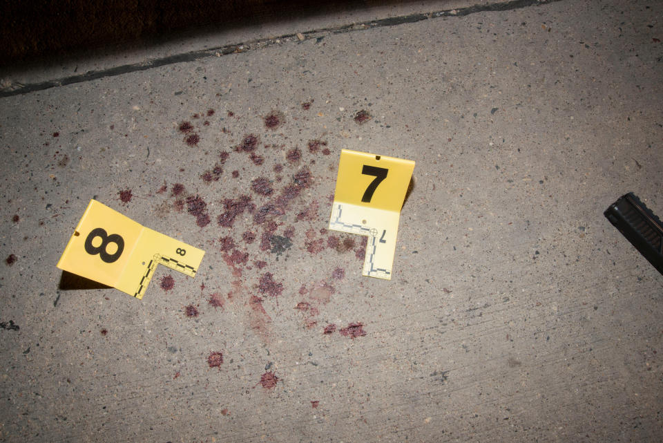 Bloodstains are seen next to markers outside the car of Philando Castile.&nbsp;