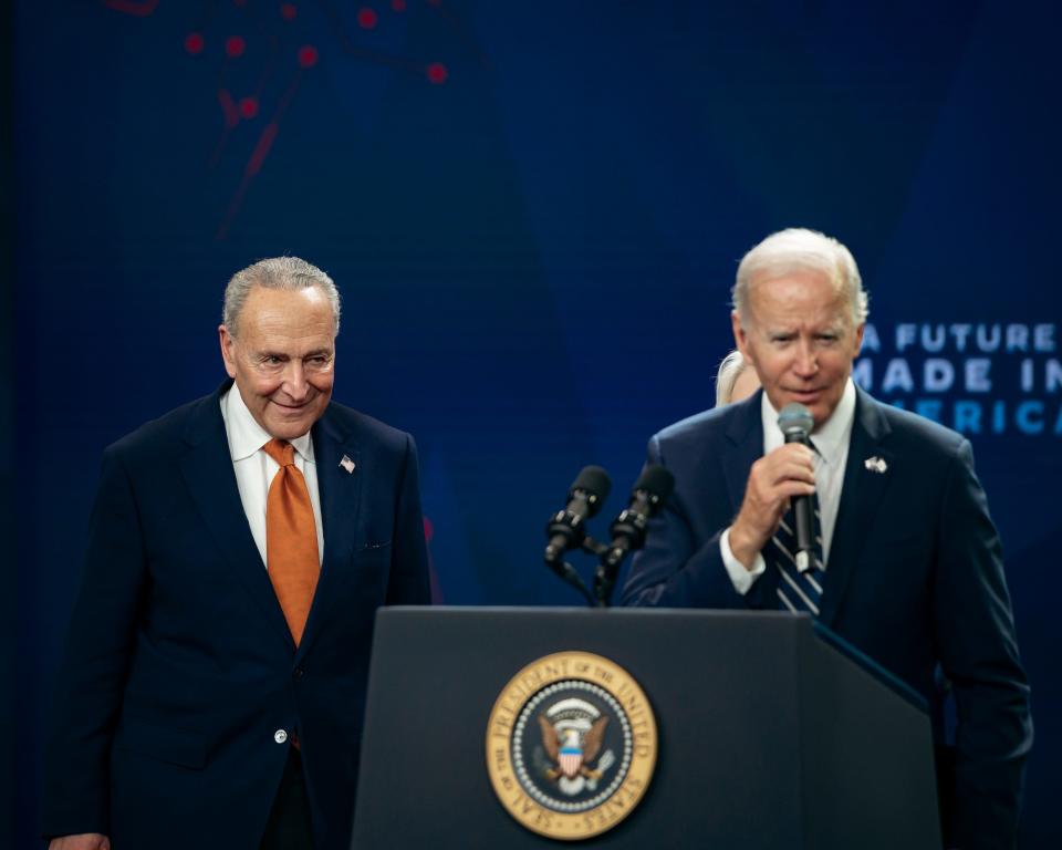 Majority Leader of the United States Senate Charles Schumer smiles towards President Biden at SRC Arena & Events Center in Syracuse on Thursday, October 27, 2022.