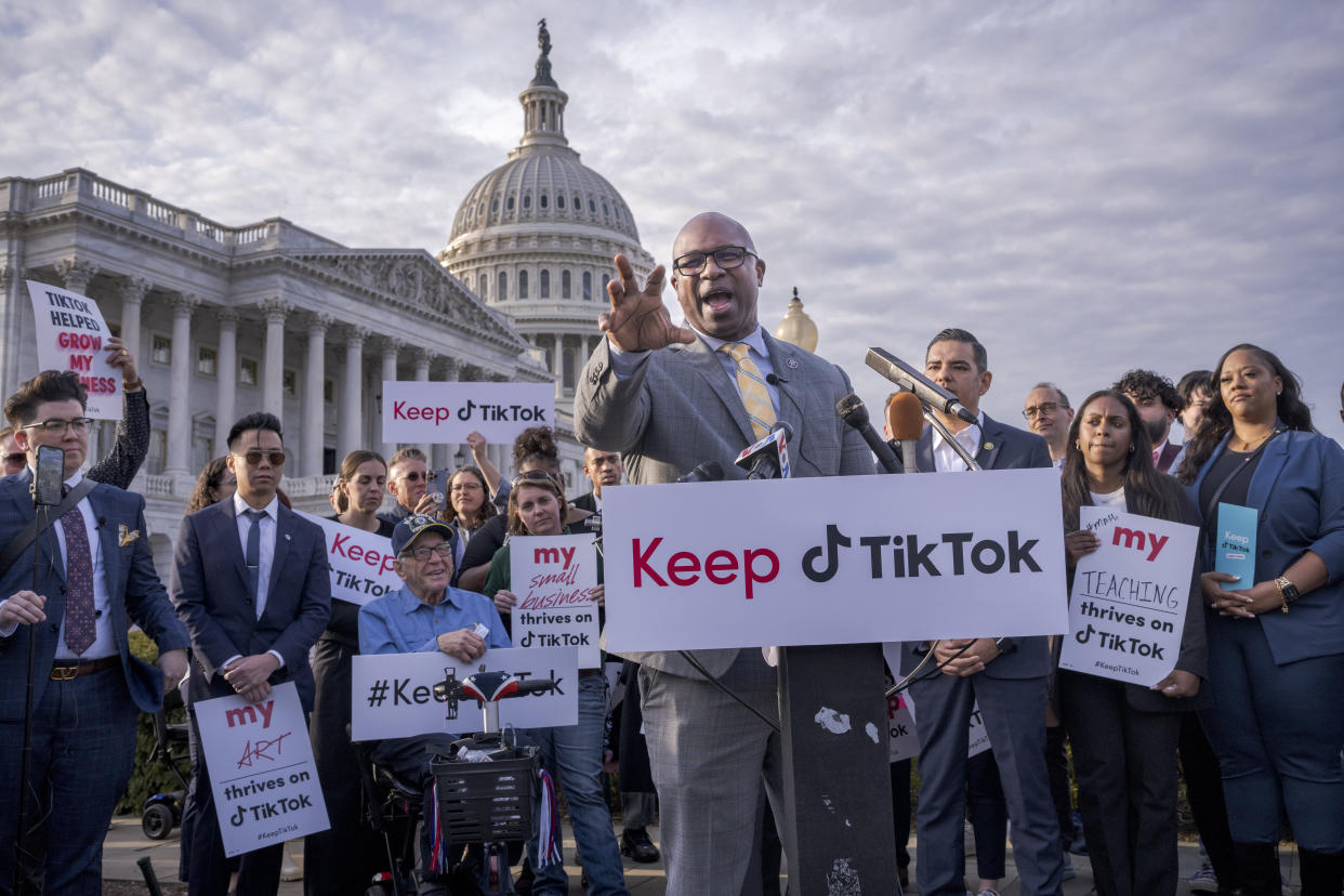 Rep. Jamaal Bowman, D-N.Y., joined by supporters of the popular app, holds a news conference at the Capitol.