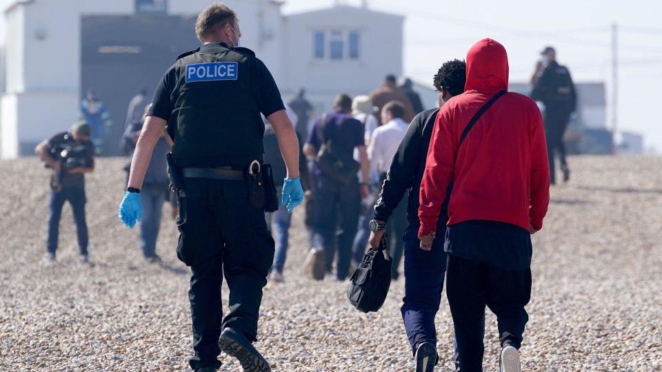  A group of people thought to be migrants are brought ashore from the Dungeness lifeboat in Dungeness, Kent.