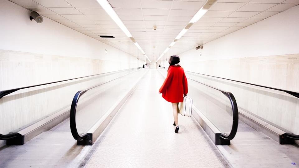 traveler walks through an airport terminal